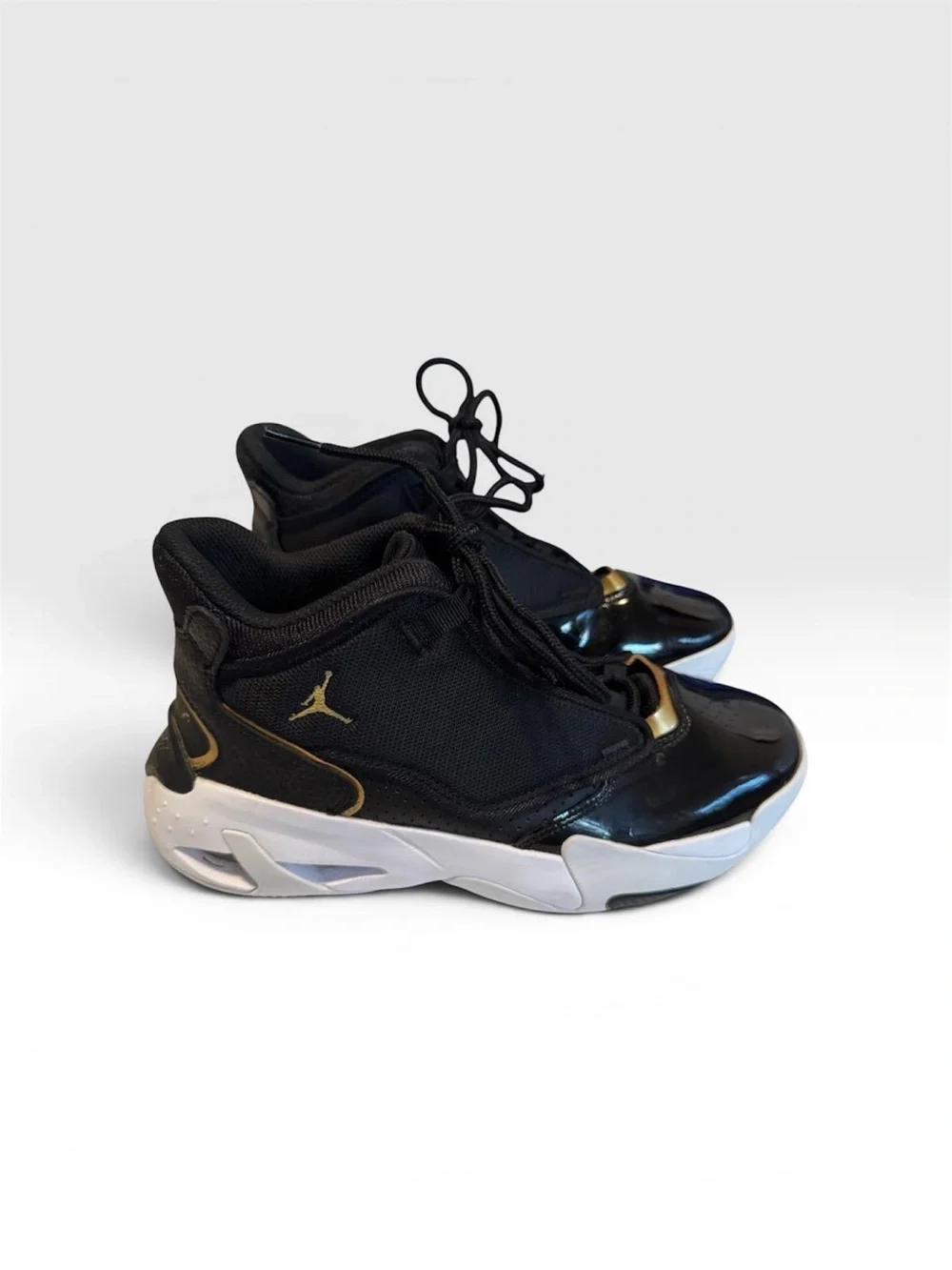 Jordan Kids Black and Gold High-Top Sneakers